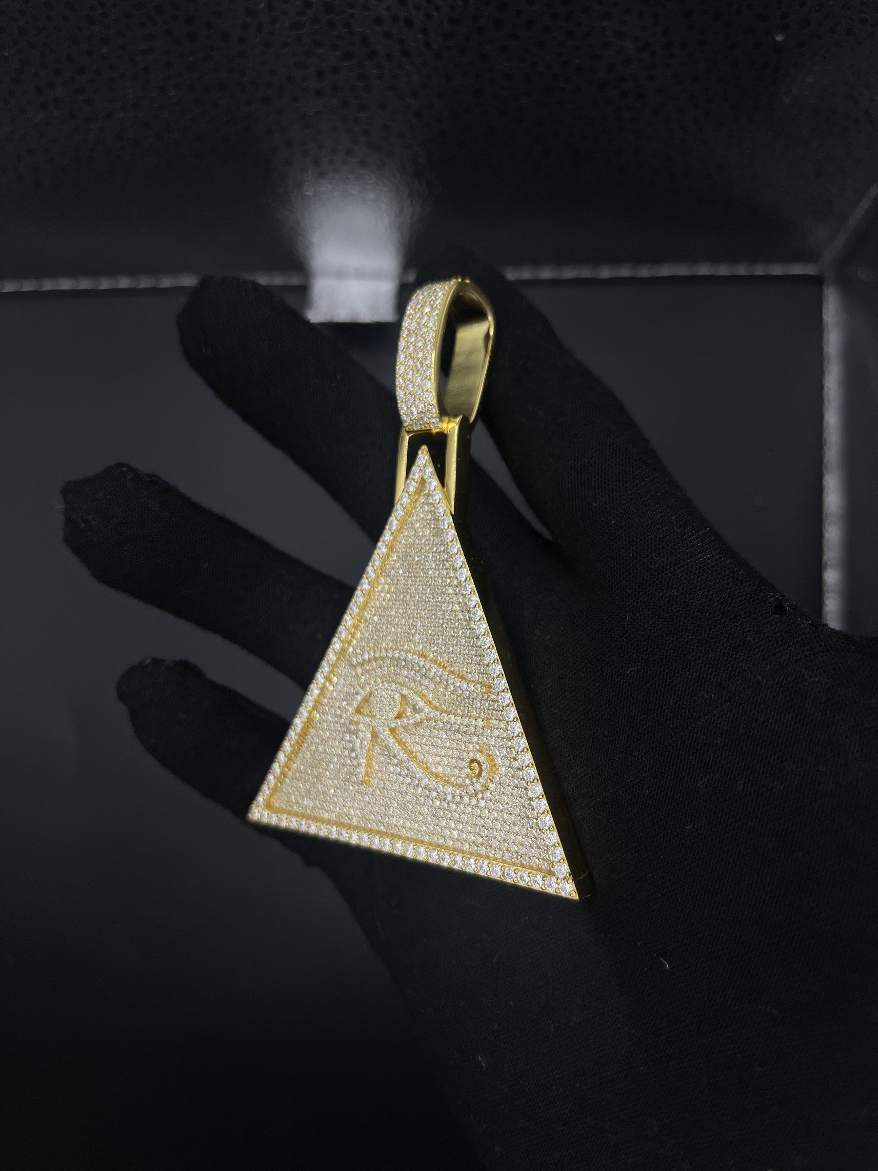 Eye of Horus pyramid pendant angle view