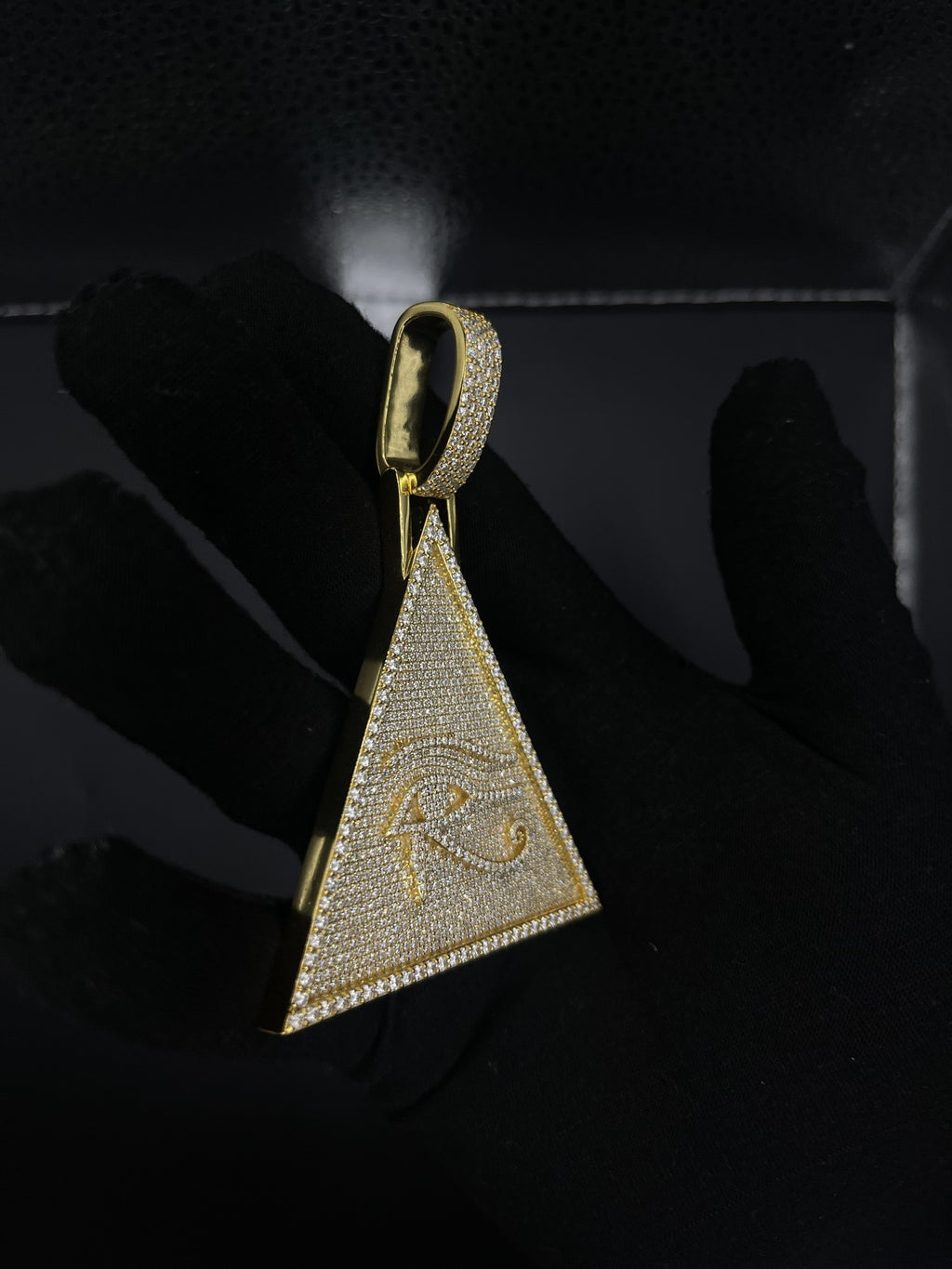 Eye of Horus pyramid pendant close-up