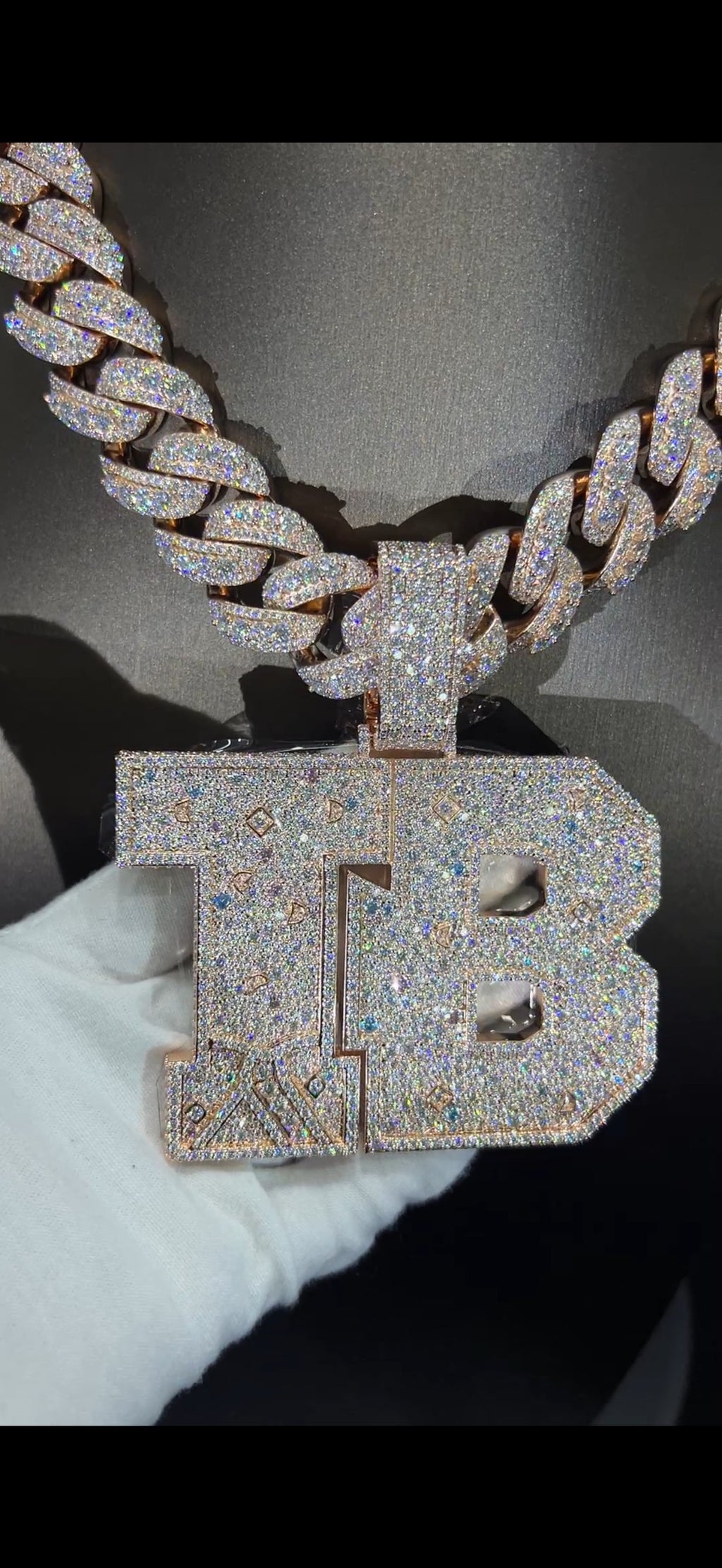 TB letter pendant on iced Cuban chain