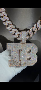 TB letter pendant on iced Cuban chain