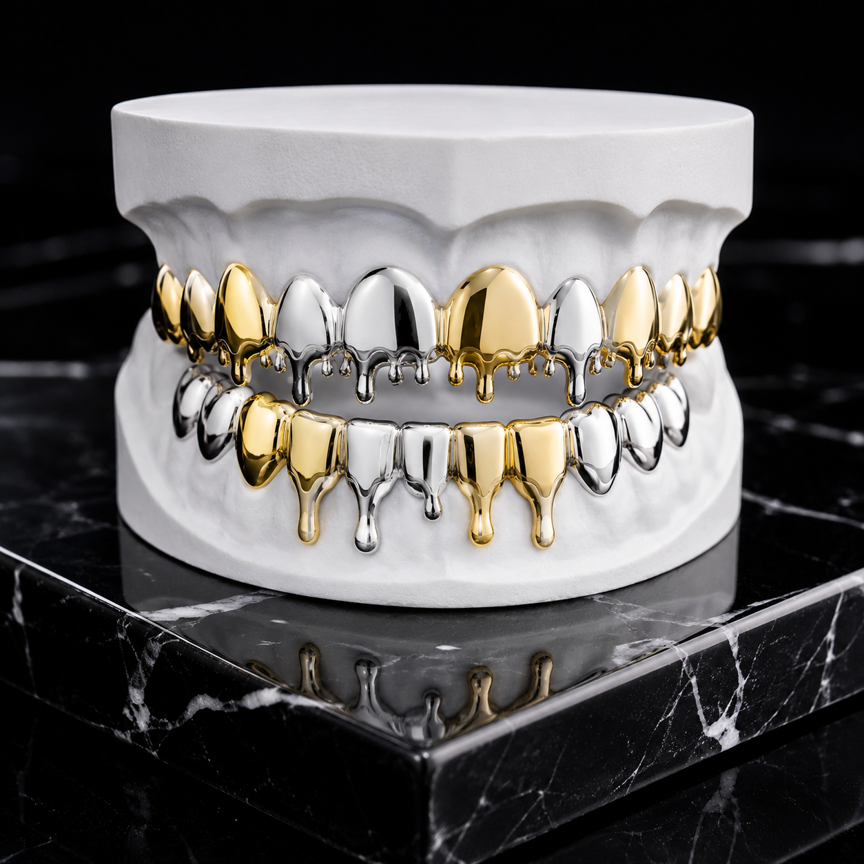 Custom Two Tone Drip Grillz handcrafted in polished yellow gold and white gold displayed on a white dental mold in a luxury jewelry photography studio.